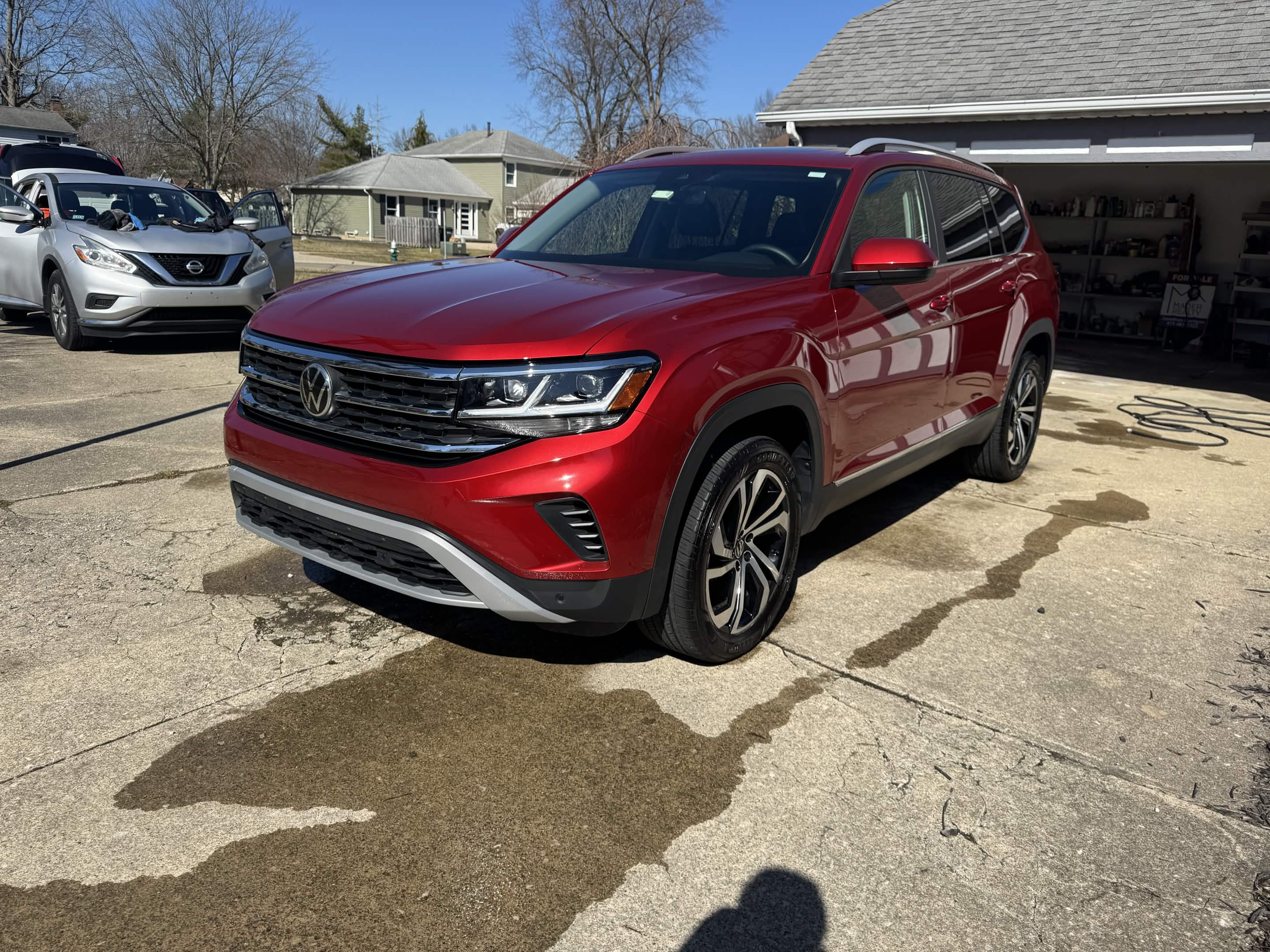 Red Volkswagen SUV after Cleveland exterior detailing with clean paint, wheels, and tires